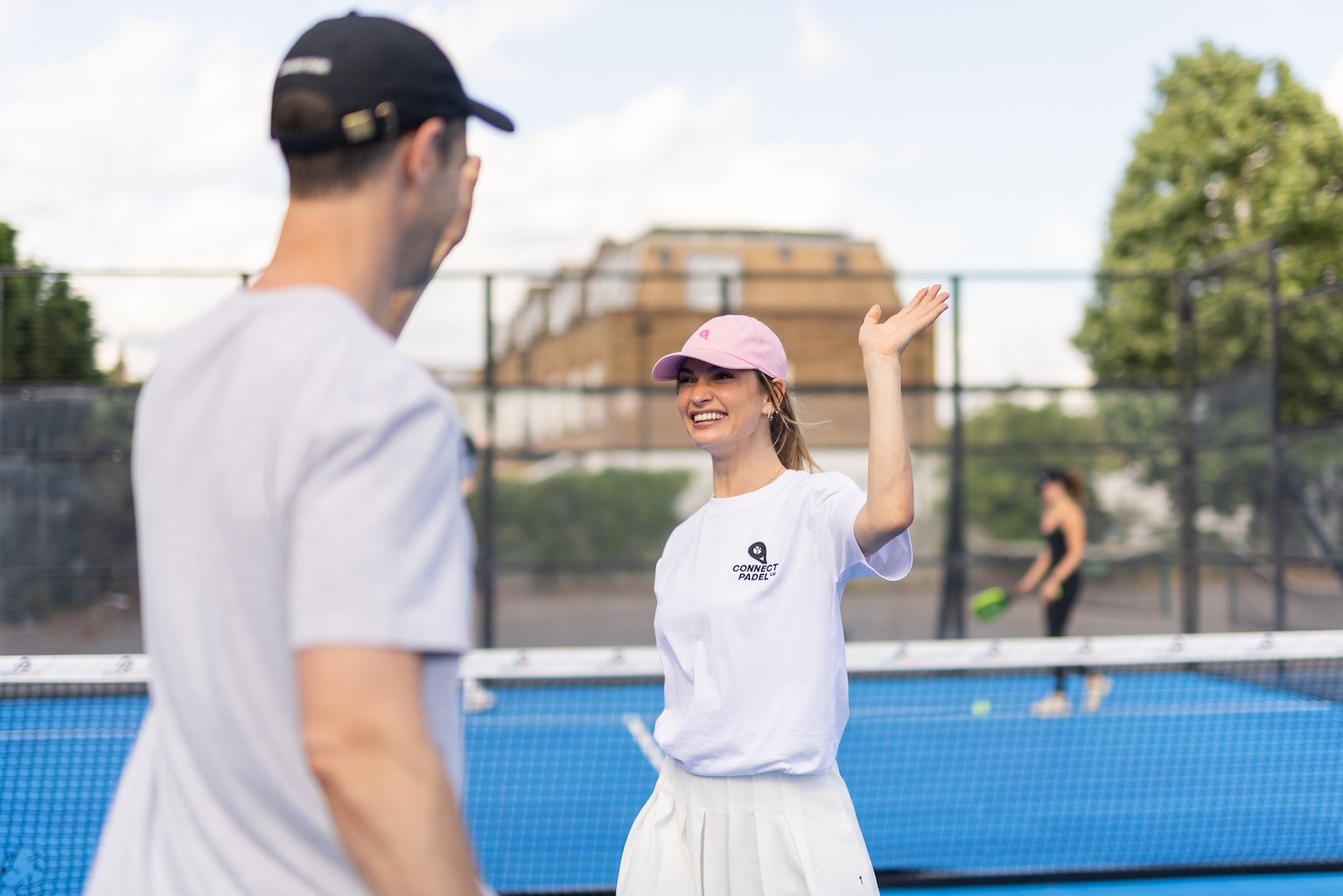 Lily James playing padel with her brother Charlie.